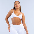 White twist-front sports bra with thin V-neck straps