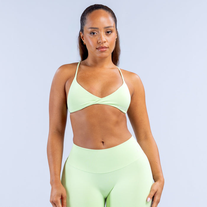 Light green twist-front sports bra with thin straps