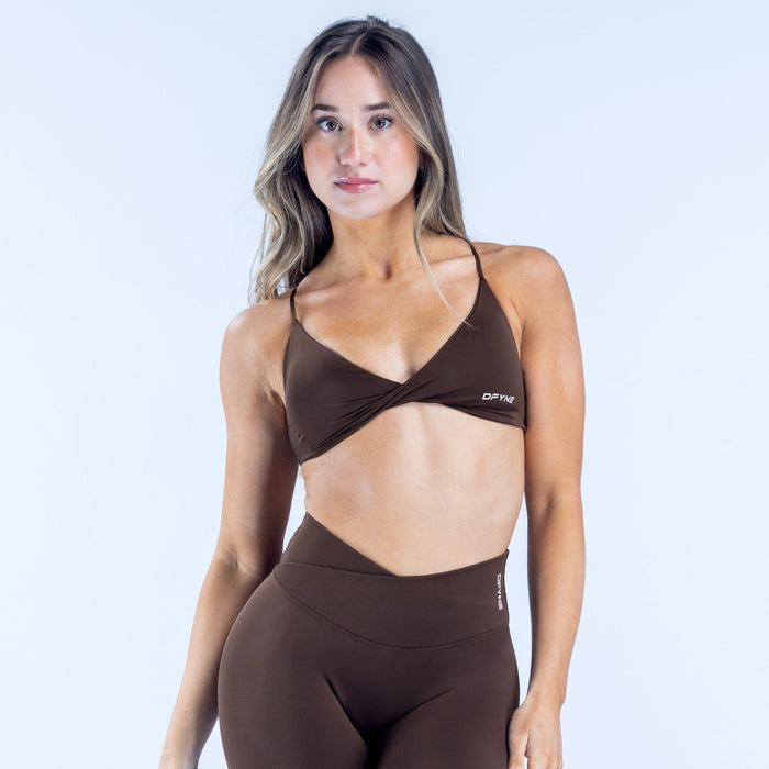Dark brown twist-front sports bra with V-neckline and DFYN logo band
