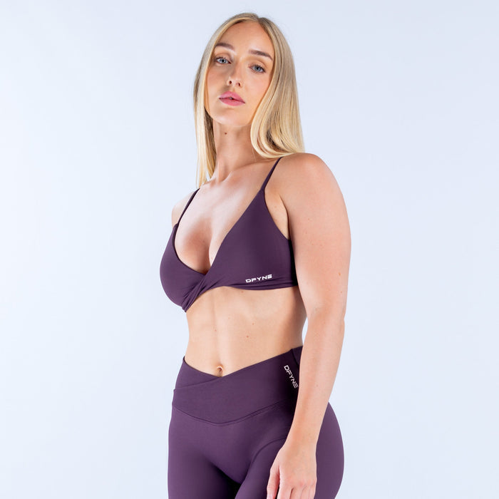 Dark purple twist-front sports bra with thin adjustable straps