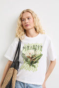 Women's white T-shirt with "Paradise" print