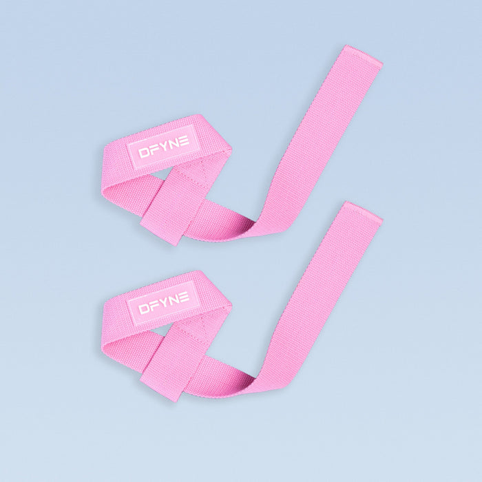 Pink wrist straps with DYNE logo, adjustable wide webbing.